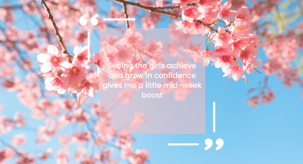 A quote reading "Seeing the girls achieve and grow in confidence gives me a little mid-week boost" on a background of blossom with a blue sky.
